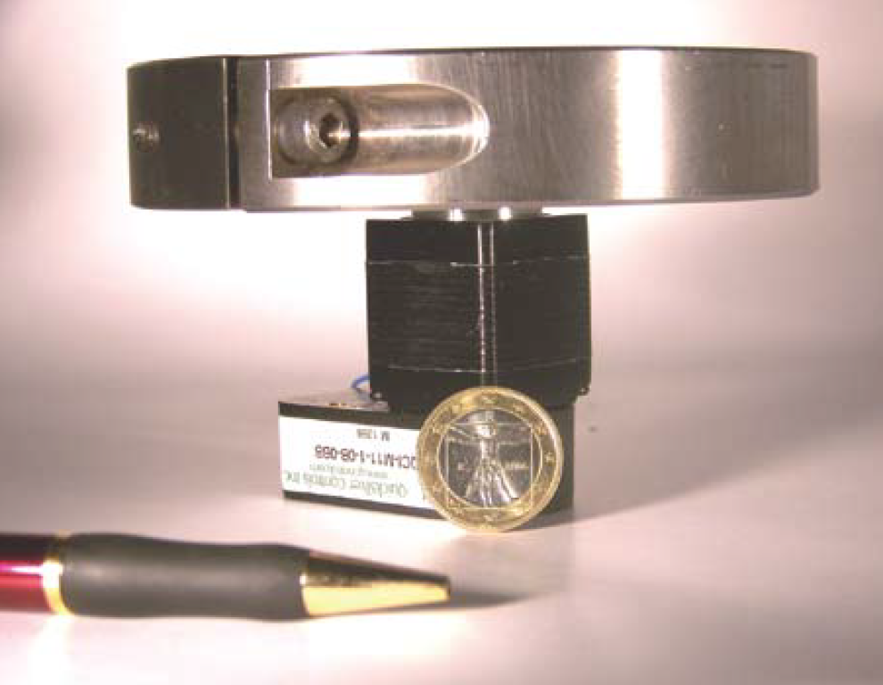 Image of a NEMA 17 Motor with a coin