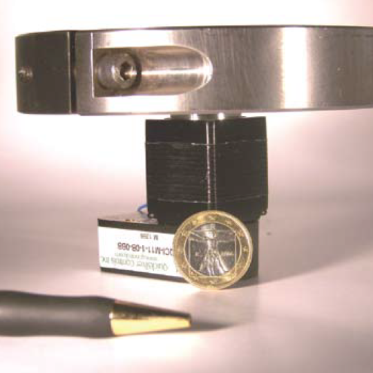 Image of a NEMA 17 Motor with a coin